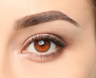 Photo of Young woman, closeup of eye. Visiting ophthalmologist