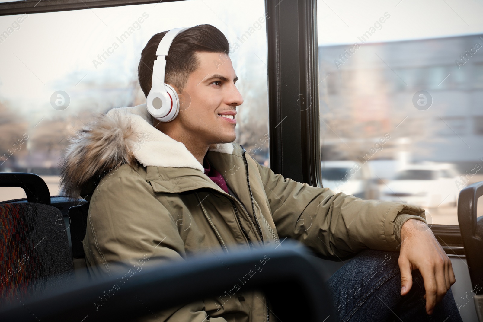 Photo of Man listening to audiobook in trolley bus