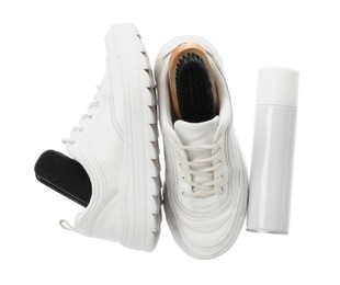 Stylish footwear and shoe care accessories on white background, top view