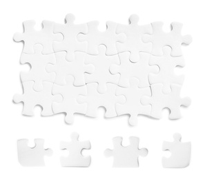 Set with jigsaw puzzle pieces on white background, top view