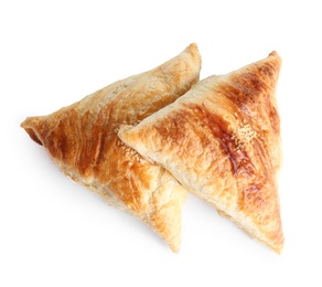 Fresh delicious puff pastry on white background, flat lay