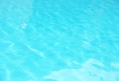 Photo of Clear refreshing water in swimming pool, closeup