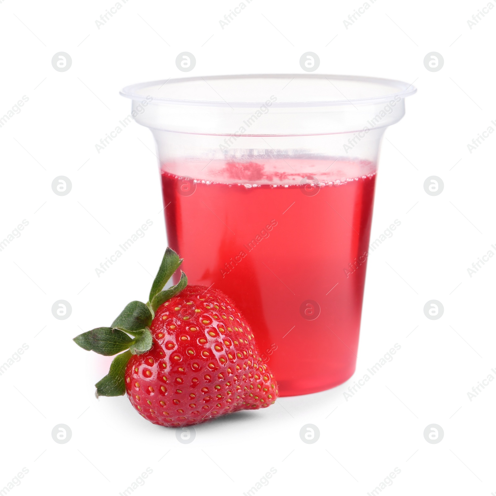 Photo of Strawberry and tasty jelly dessert in plastic cup on white background