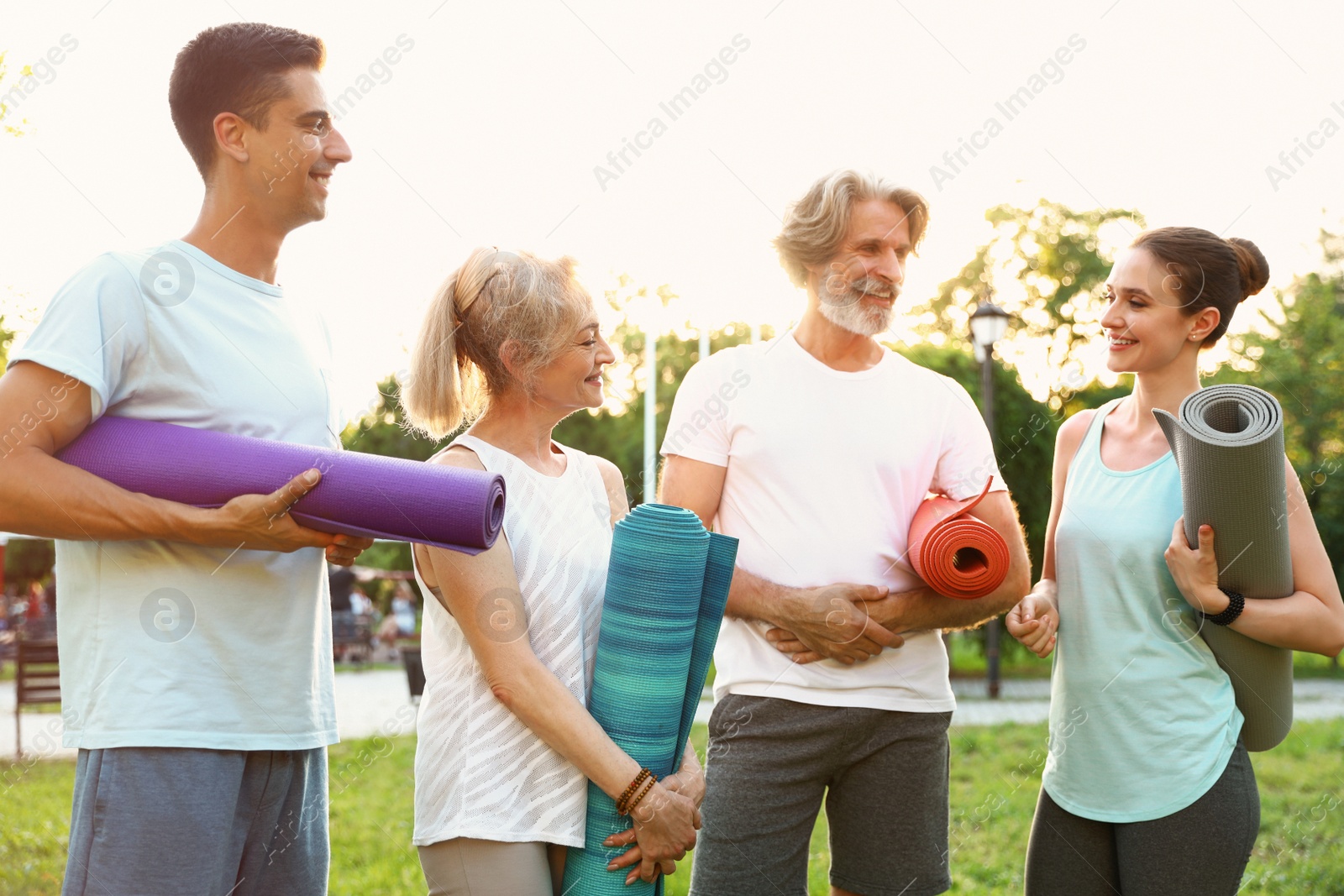 Photo of Group of people before morning yoga practice in park