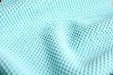 Photo of Textured light blue fabric as background, closeup