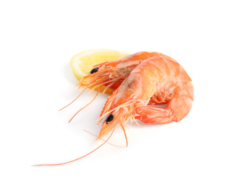 Delicious cooked shrimps and lemon isolated on white