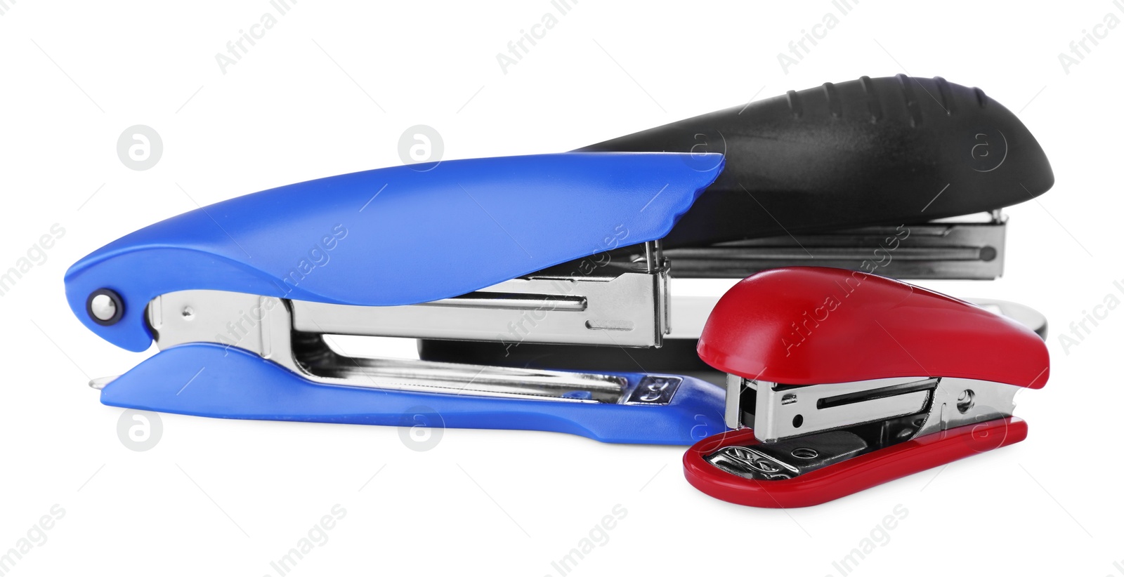 Photo of New bright color staplers isolated on white