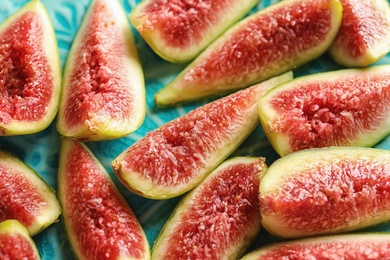 Fresh ripe fig slices on plate, closeup. Tropical fruit