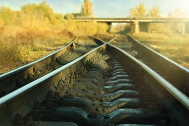 Photo of Railway lines in countryside on sunny day. Train journey