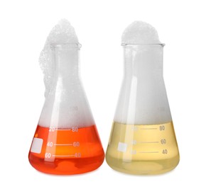 Laboratory flasks with colorful liquids isolated on white. Chemical reaction
