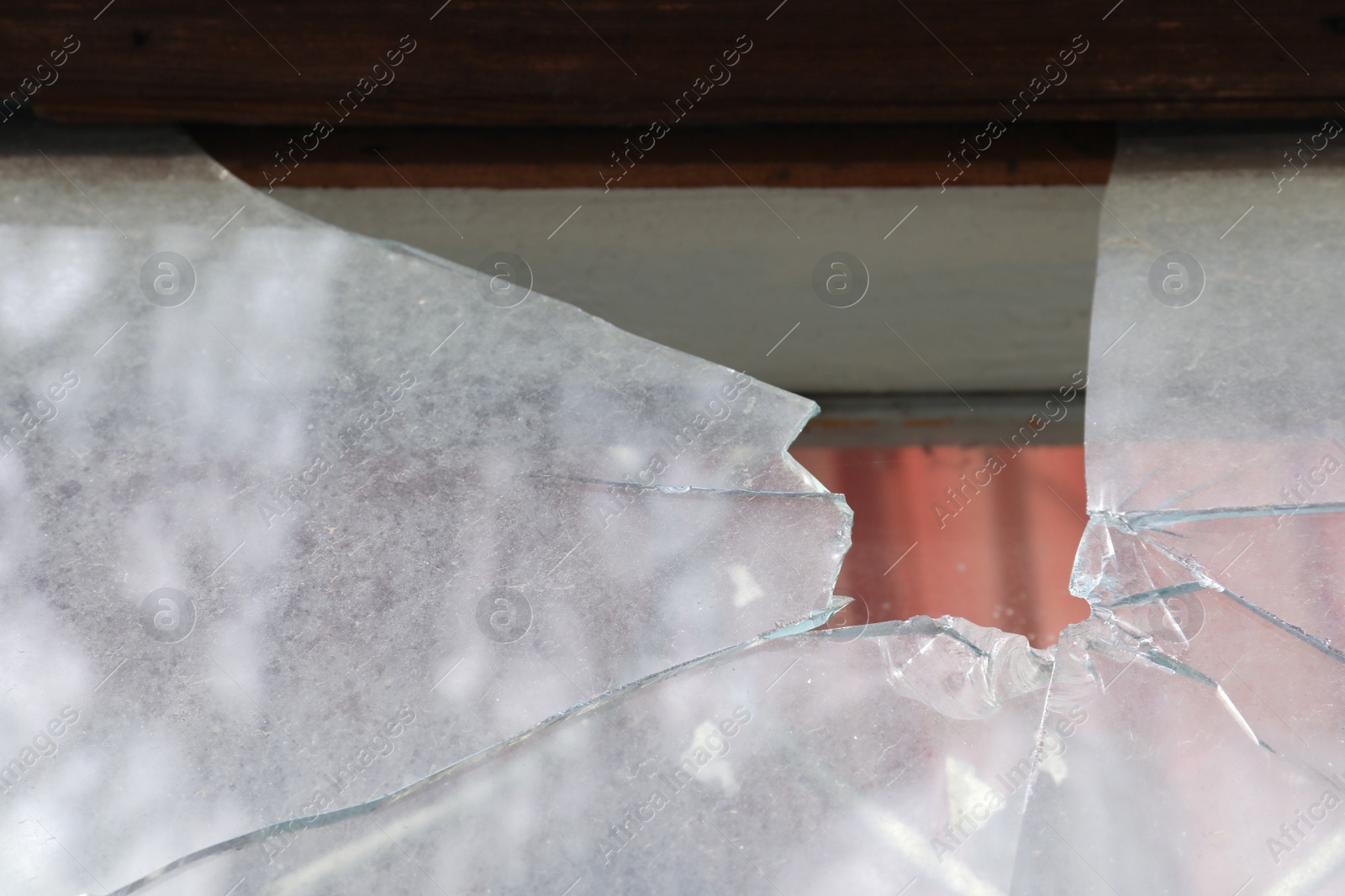 Photo of Broken window of abandoned house outdoors, closeup. Requiring repair