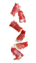 Image of Falling delicious sliced jamon on white background