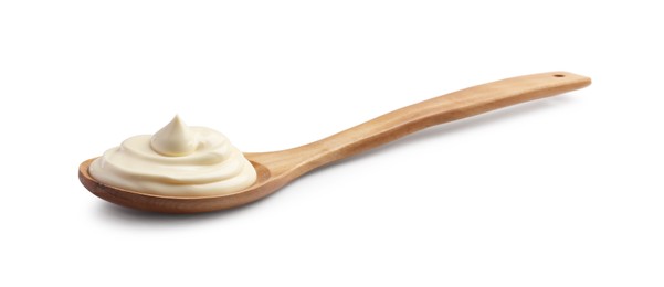 Photo of Natural yogurt in wooden spoon isolated on white