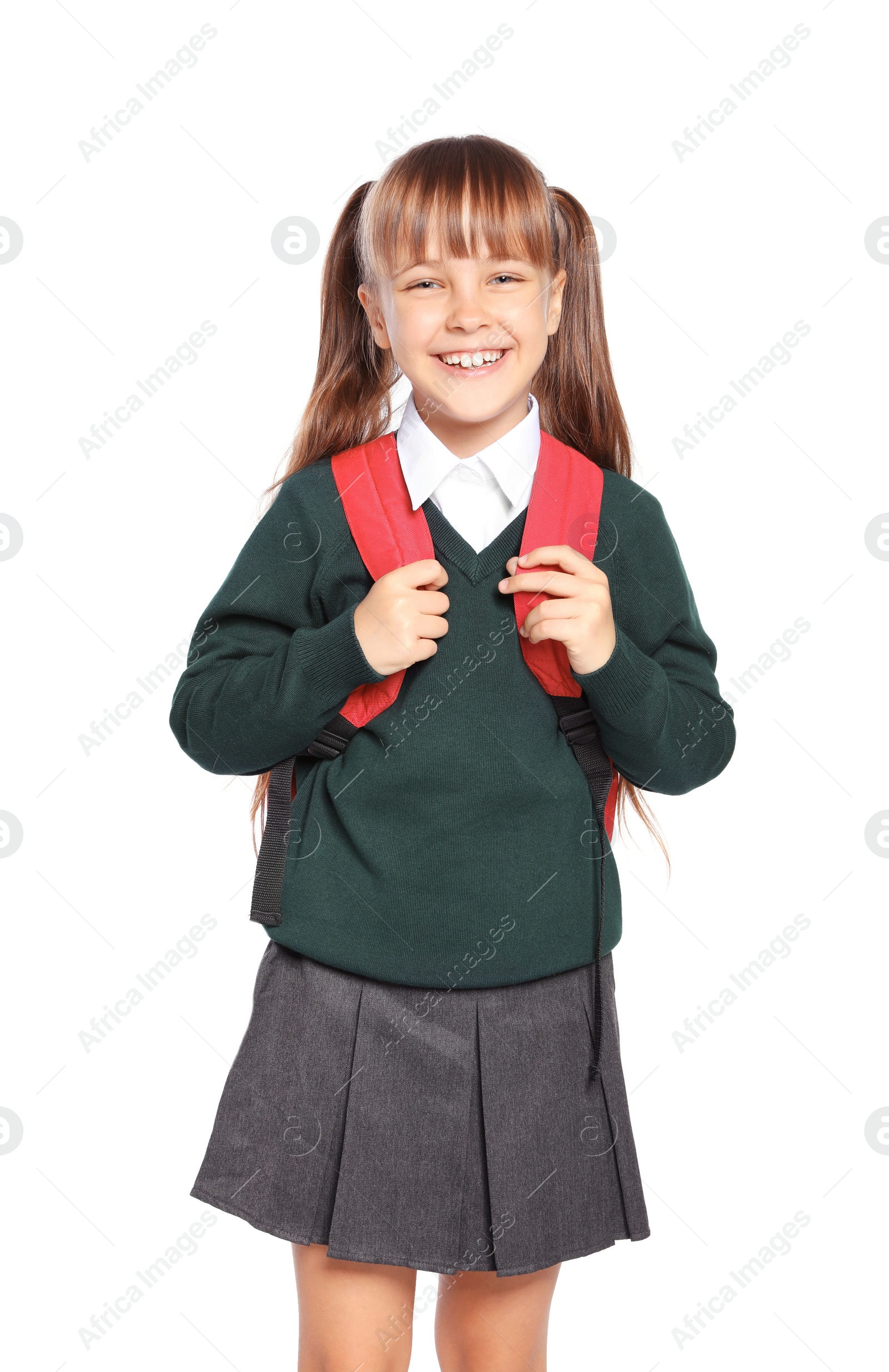 Photo of Little girl in stylish school uniform on white background