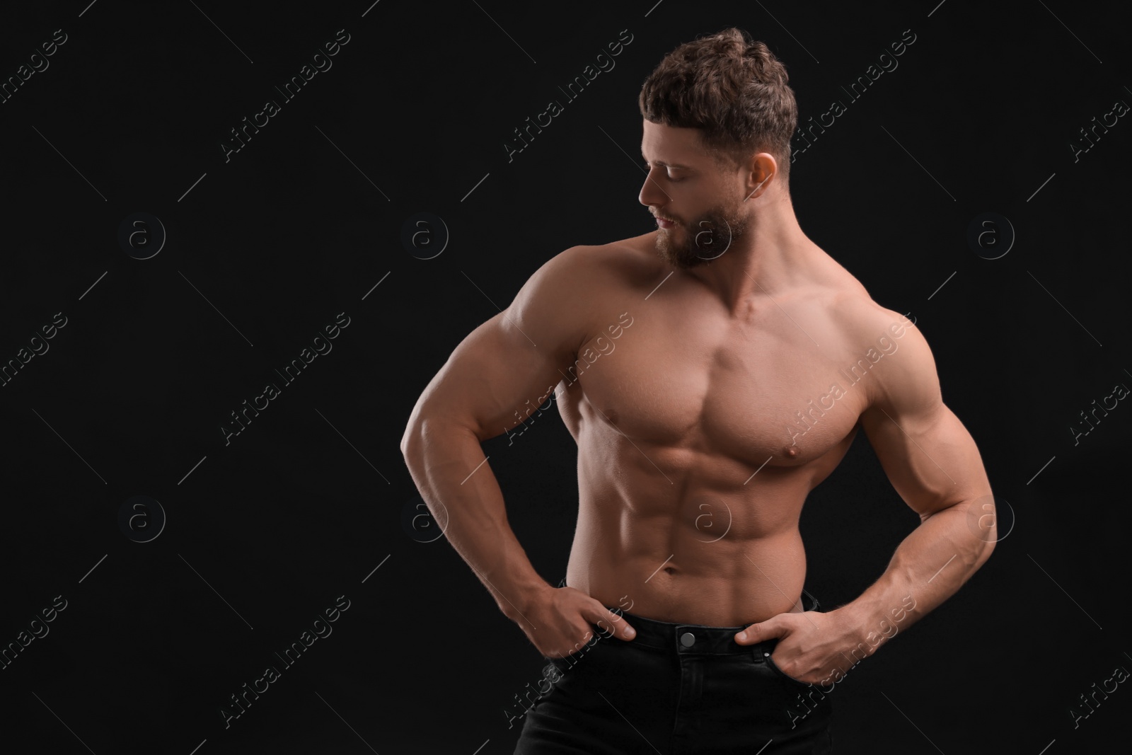 Photo of Handsome muscular man on black background, space for text. Sexy body