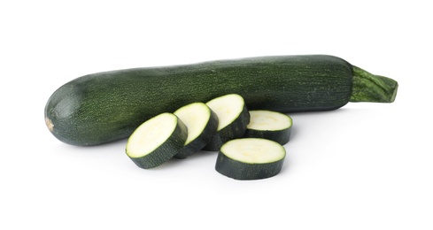 Photo of Cut and whole green ripe zucchini isolated on white