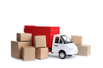 Photo of Truck model and carton boxes on white background. Courier service