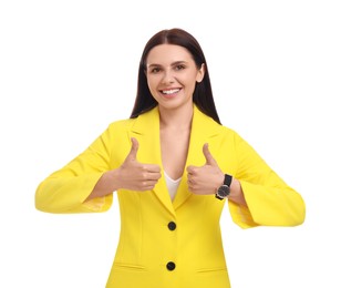 Beautiful happy businesswoman in yellow suit showing thumbs up on white background