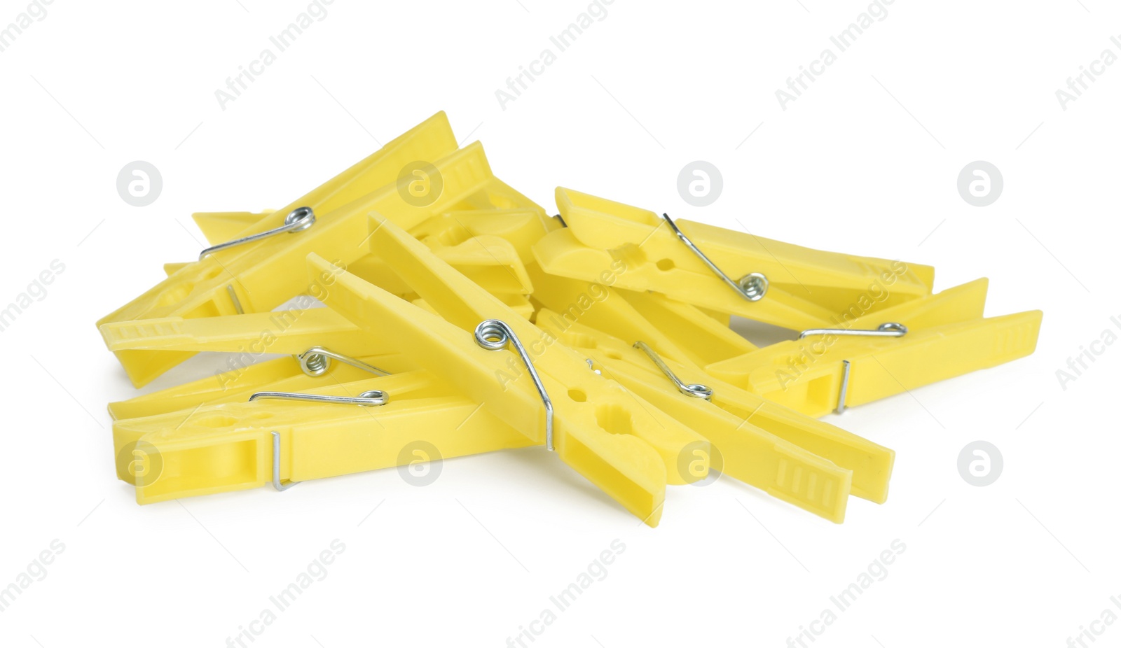 Photo of Bright yellow plastic clothespins on white background