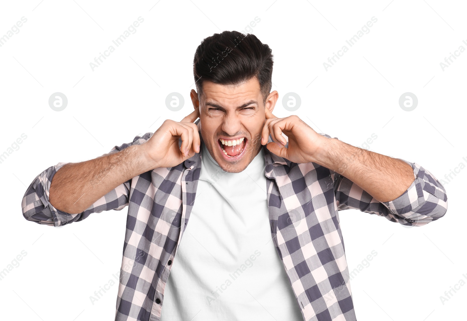 Photo of Emotional man covering ears with fingers on white background