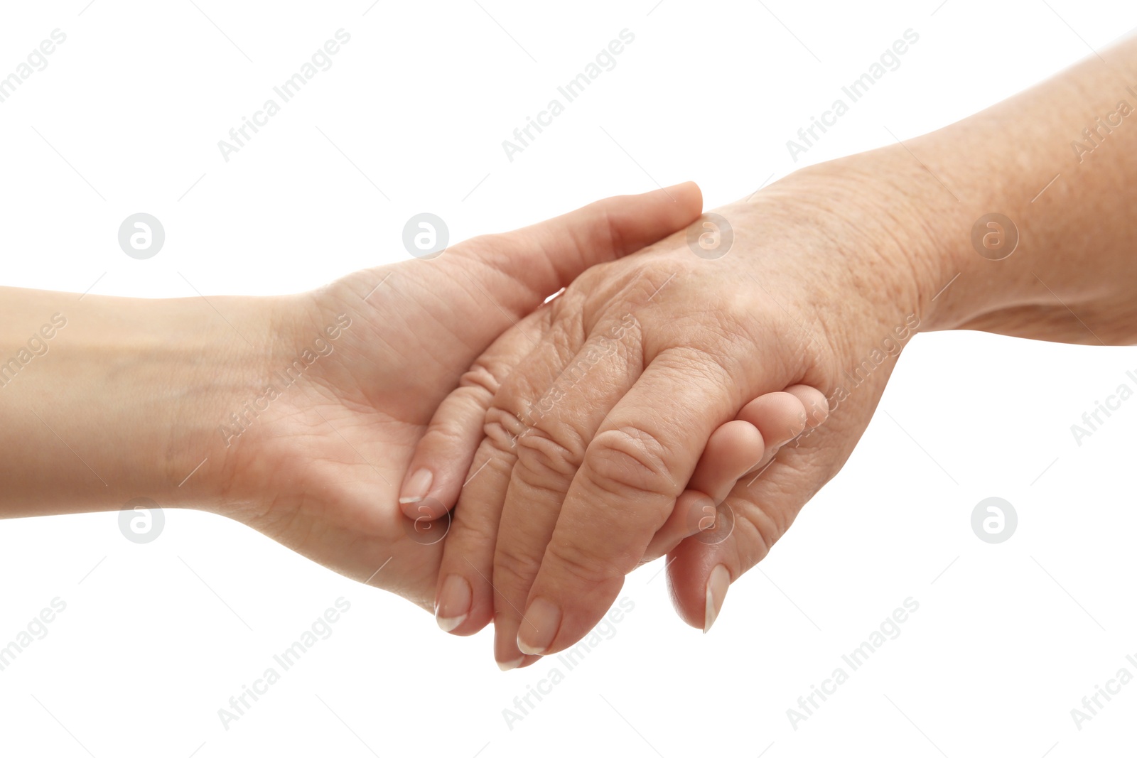 Photo of Young and elderly women holding hands together on white background, closeup