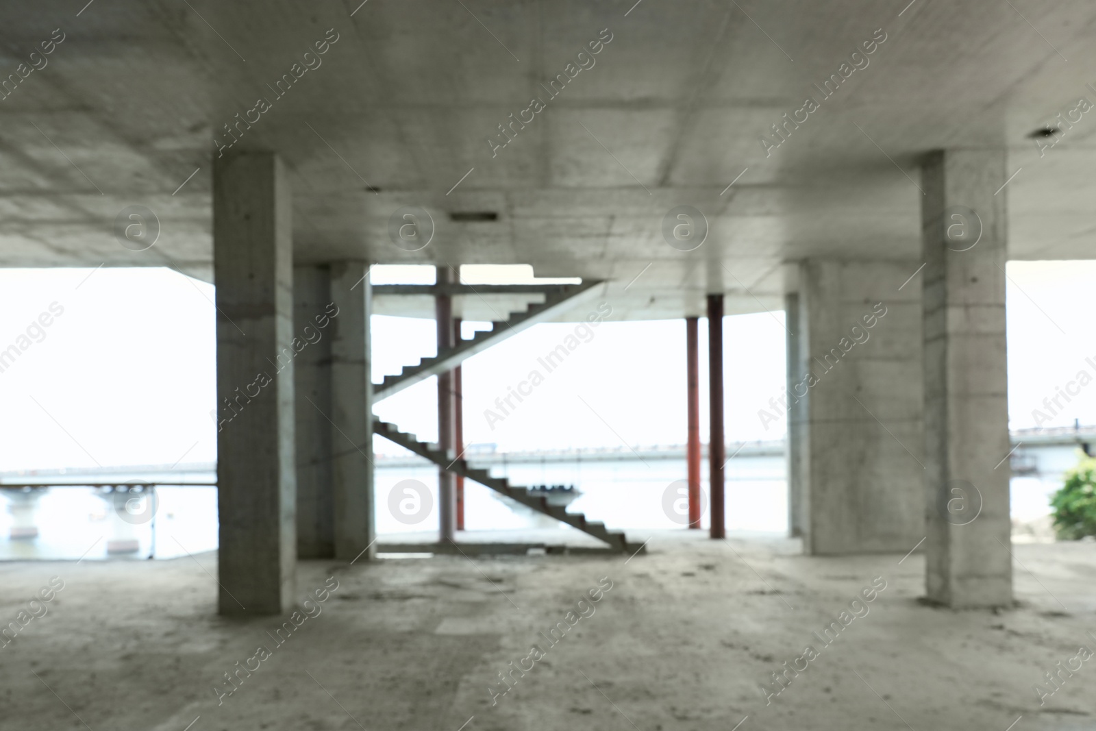 Photo of Blurred view of unfinished building indoors. Construction safety rules