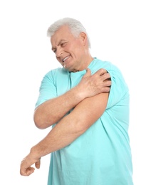 Mature man scratching arm on white background. Annoying itch