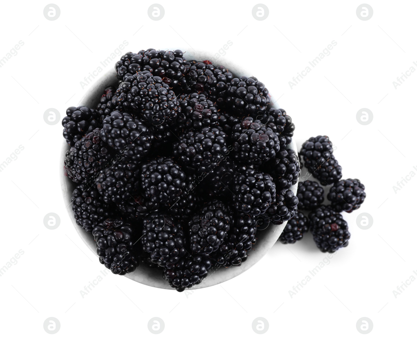 Photo of Fresh ripe blackberries in bowl isolated on white, top view