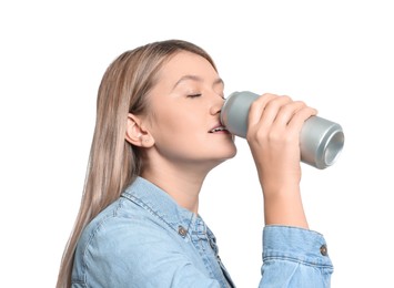 Photo of Beautiful woman drinking from beverage can on white background