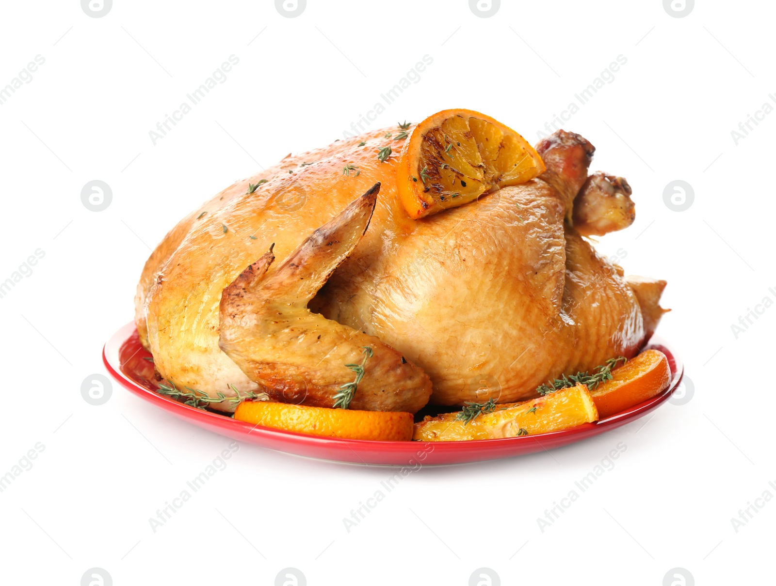 Photo of Roasted chicken with oranges isolated on white