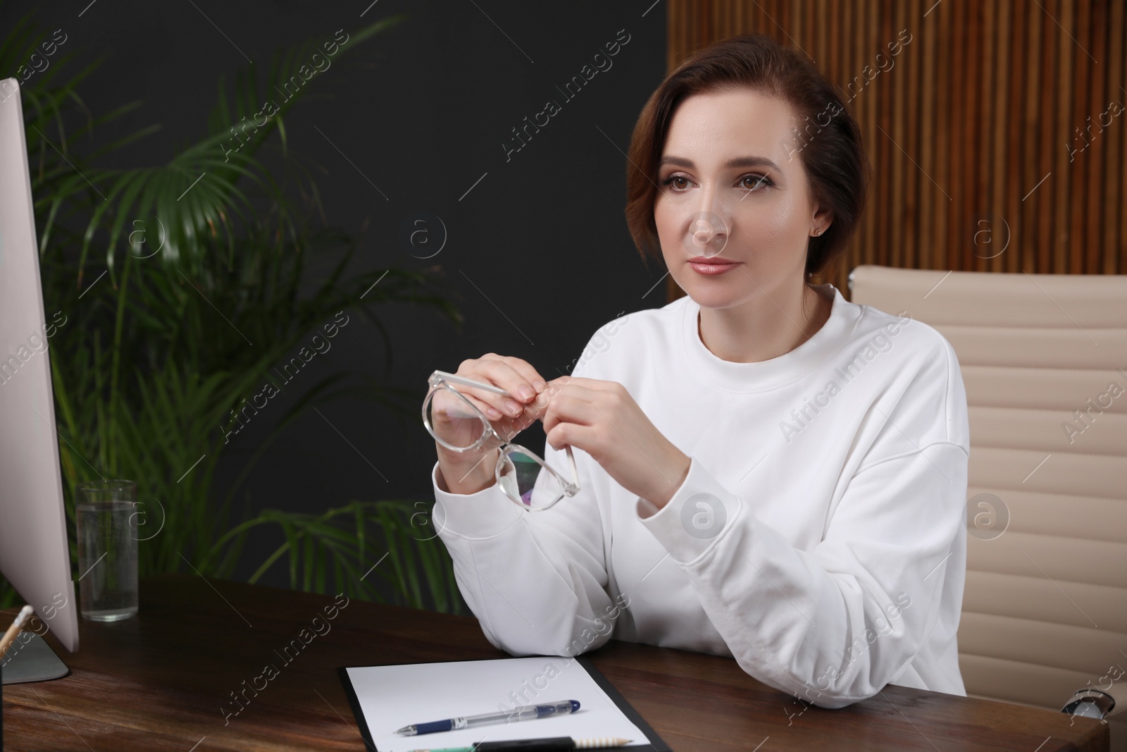 Photo of Portrait of psychotherapist at table in office