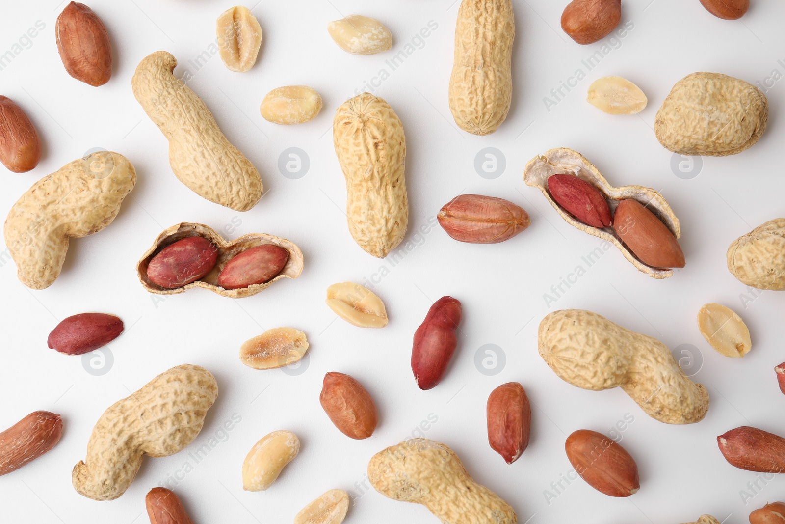 Photo of Fresh peanuts on white table, flat lay