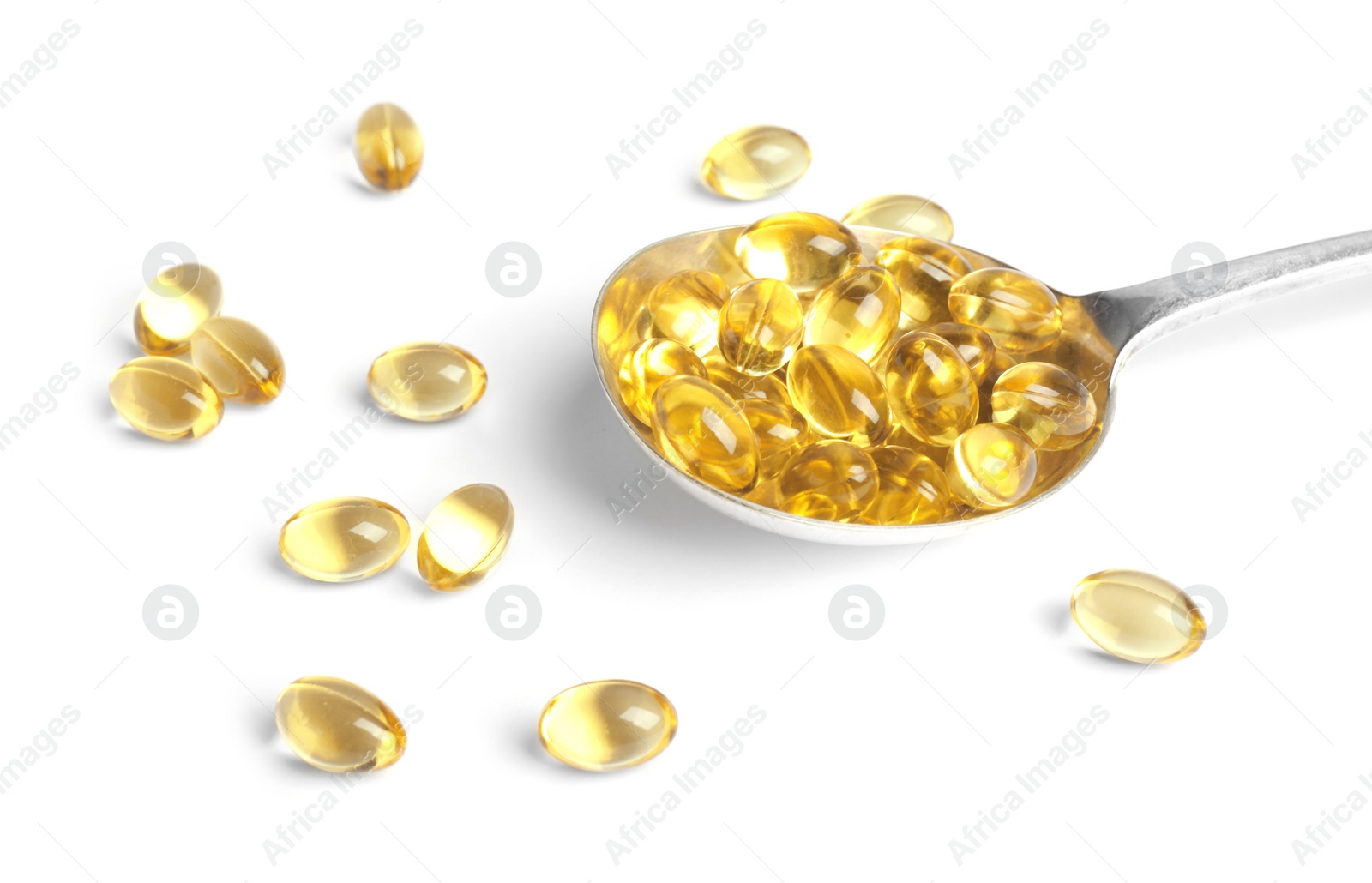 Photo of Spoon with cod liver oil pills on white background