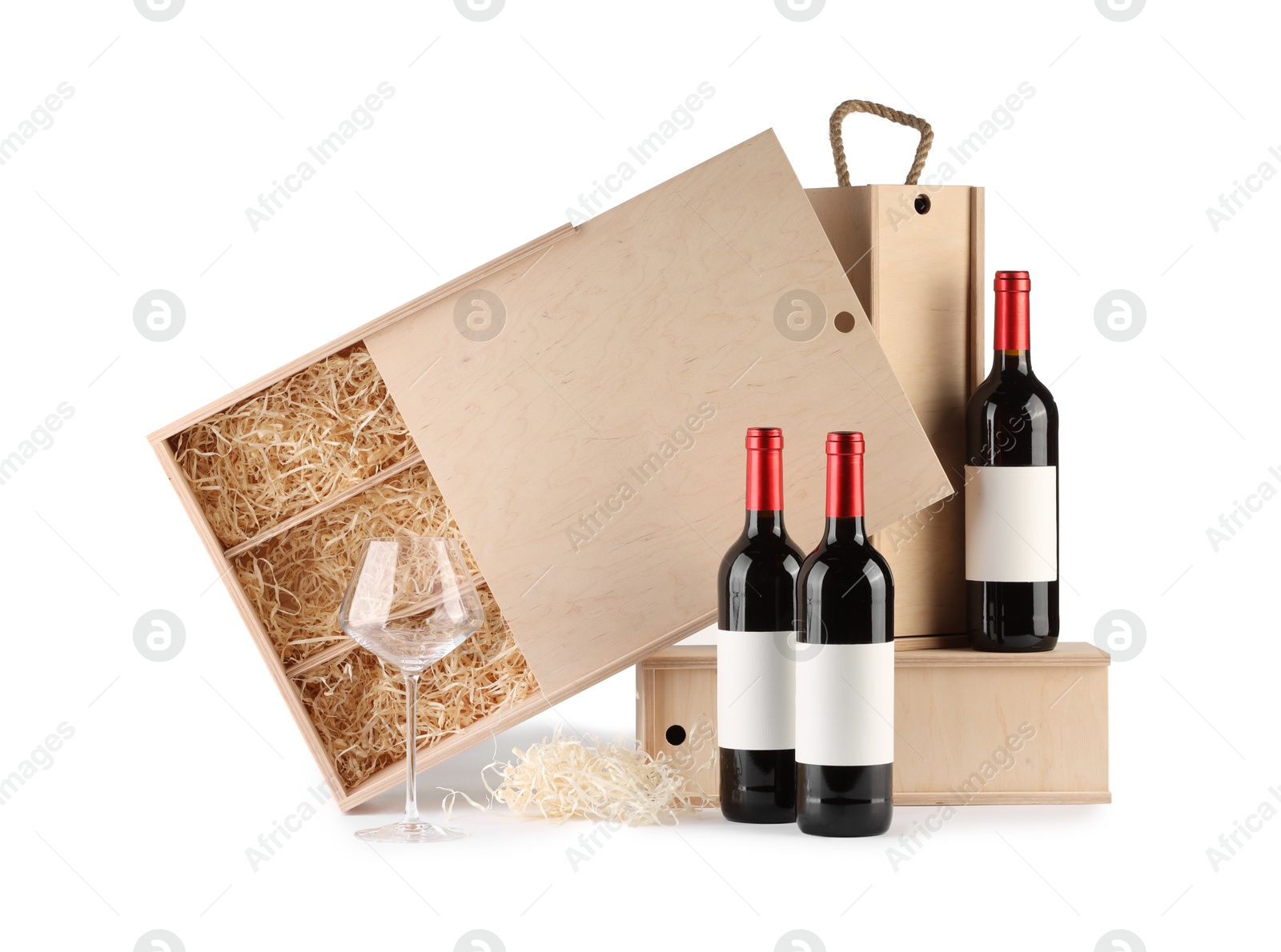 Photo of Wooden gift boxes with wine and glass isolated on white