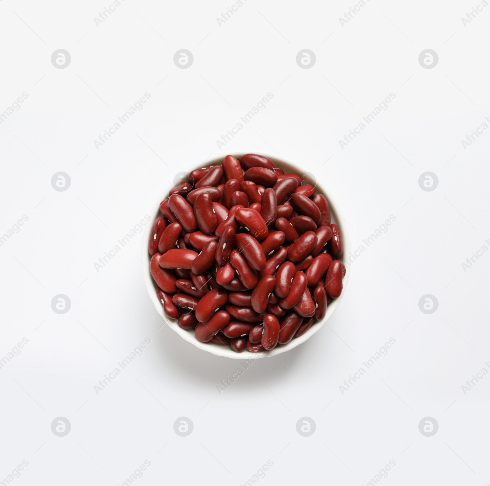 Photo of Bowl with beans on white background, top view. Natural food high in protein