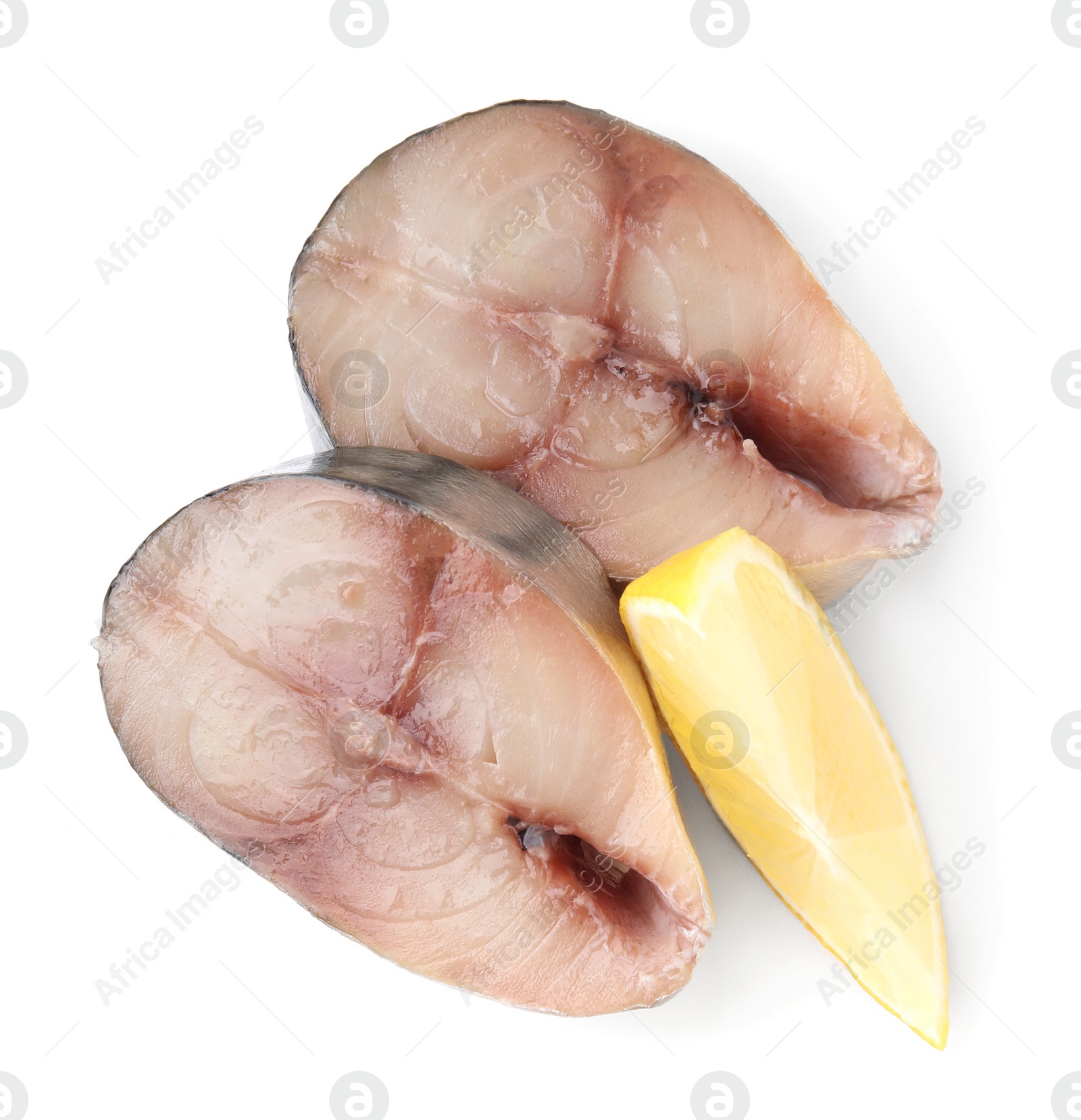 Photo of Slices of tasty salted mackerel and lemon wedge isolated on white, top view