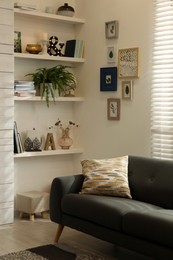 Photo of Cozy living room interior with comfortable sofa near window