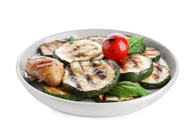 Photo of Plate of delicious grilled zucchini slices on white background