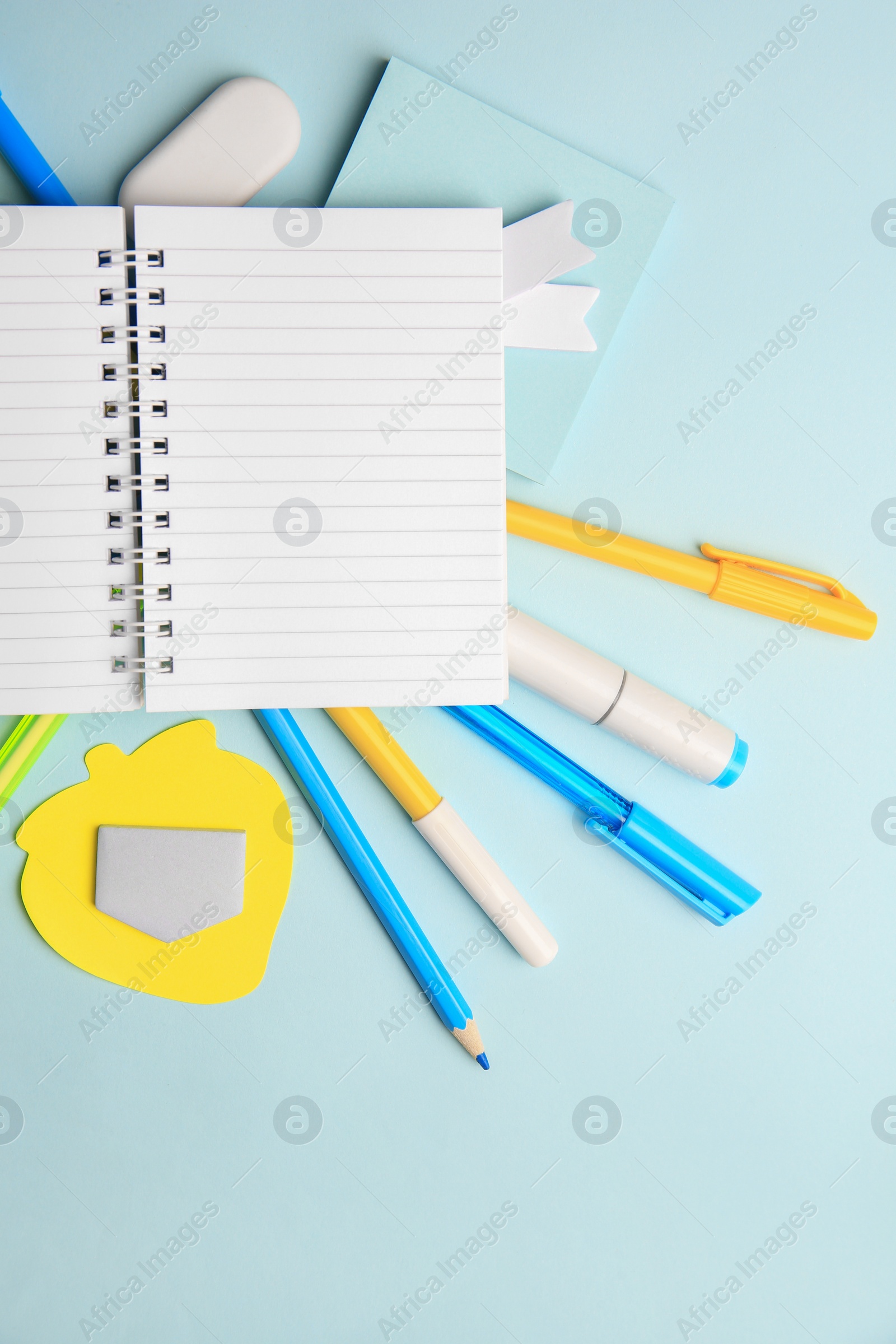 Photo of Different school stationery on light blue background, flat lay with space for text. Back to school