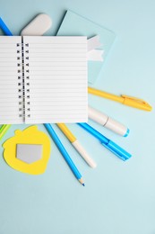 Different school stationery on light blue background, flat lay with space for text. Back to school