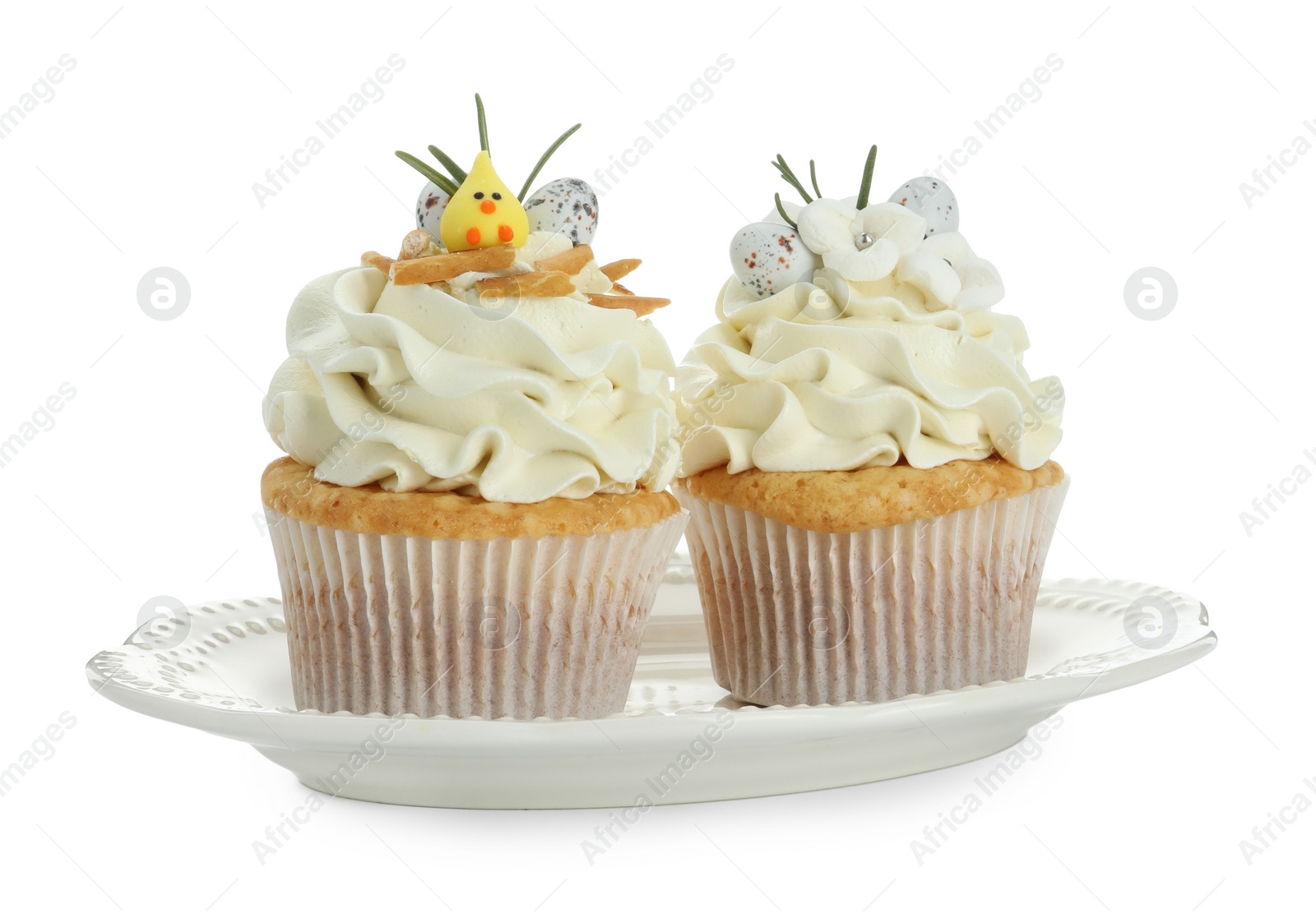 Photo of Tasty Easter cupcakes with vanilla cream isolated on white