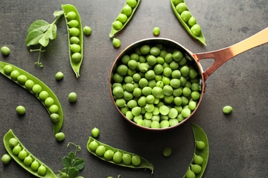 Flat lay composition with green peas on grey background