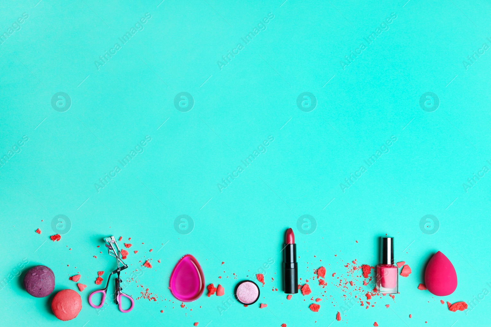 Photo of Decorative makeup products on color background