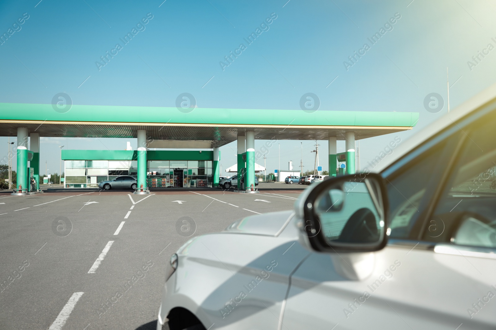 Photo of Modern car driving to gas station, closeup