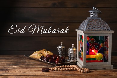 Image of Eid Mubarak greeting card. Composition with Arabic lantern and misbaha on wooden table