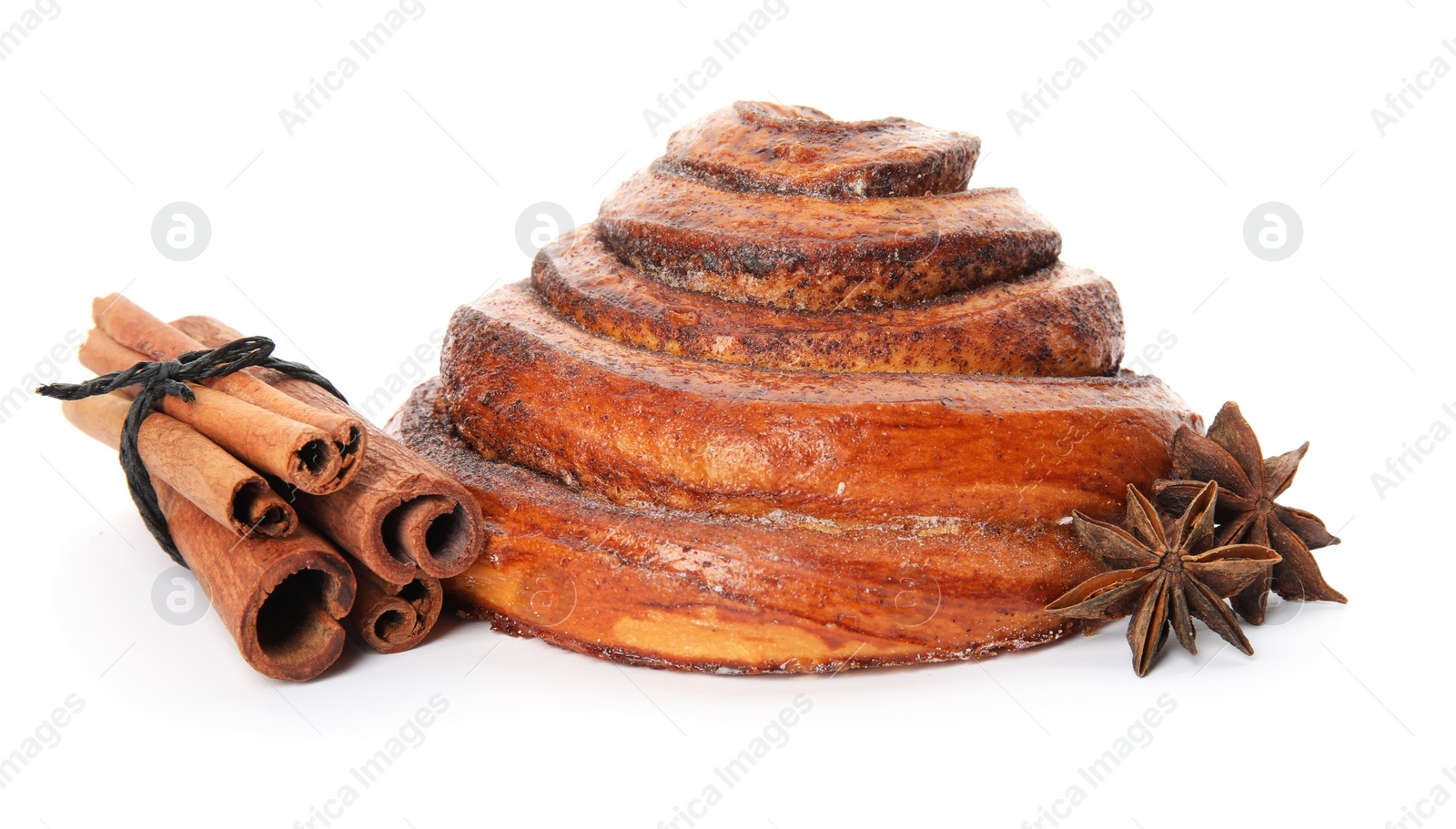 Photo of Freshly baked cinnamon roll with ingredients on white background