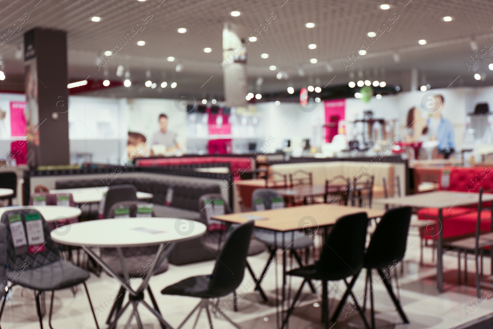 Photo of Blurred view of furniture store in mall. Bokeh effect