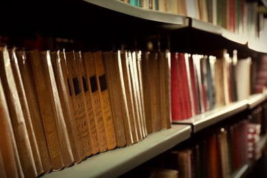 Image of Collection of different books on shelf in library