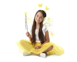 Cute little girl in fairy costume with yellow wings on white background