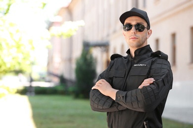 Portrait of male security guard in uniform outdoors